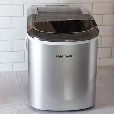 FRIGIDAIRE<sup>&reg;</sup> Compact Ice Maker - This portable ice maker produces up to 26lbs of ice per day. Large see through window allows for process monitoring and ice level checking. Features include compressor cooling, ice in less than 6 min and (2) choices of ice size. 