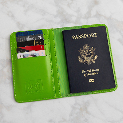 SMOOTH TRIP<sup>&reg;</sup> RFID-Blocking Passport Holder - Protect your credit card, license and passport information against electronic scanner theft with this RFID lined holder.  Space for 5 cards and 2 pockets for receipts and money.  Measures 3.75" x 5.5".